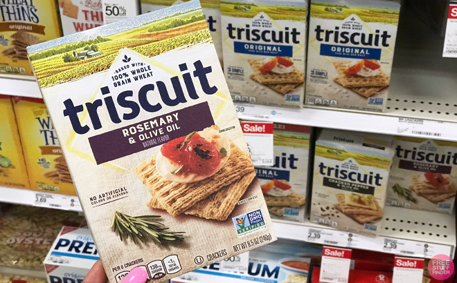 Woman holding a Triscuit Rosemary Olive Oil Crackers