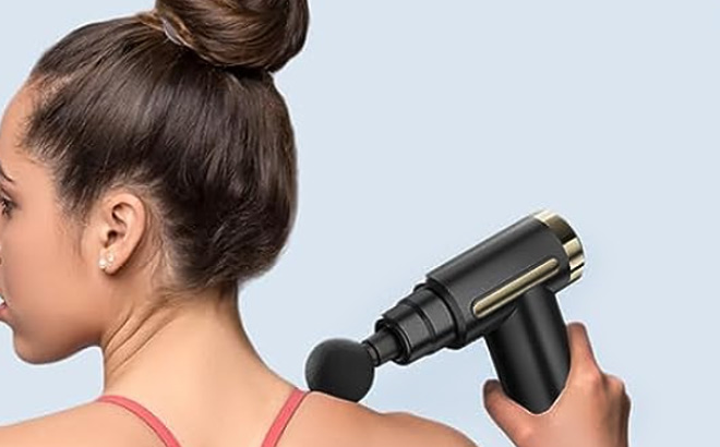 Woman is Using Morelax Mini Massage Gun