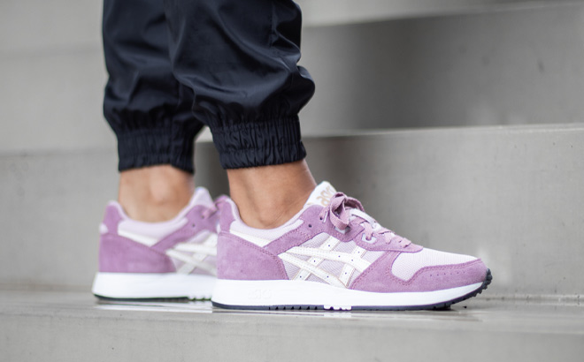 Woman is Wearing Asics Lyte Classic in Watershed Rose and Cream Color