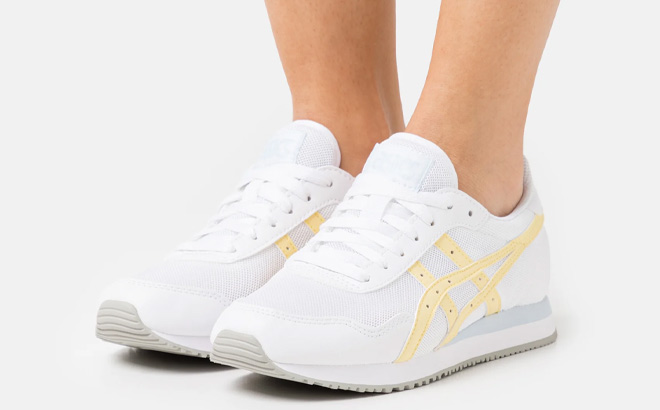 Woman is Wearing Asics Tiger Runner in White and Butter Color