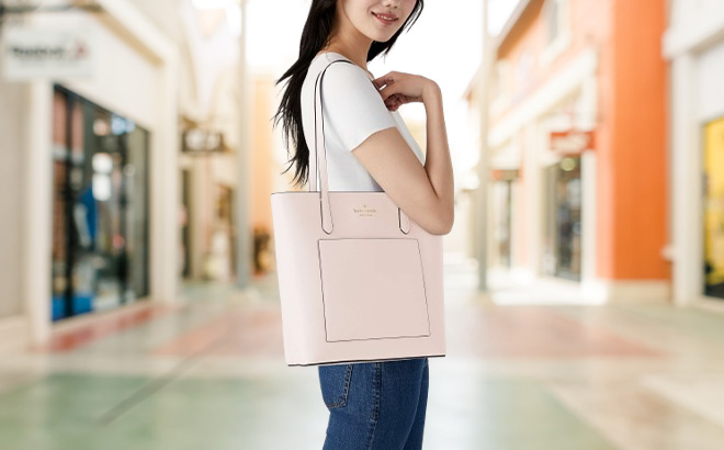 Woman is Wearing Kate Spade Daily Tote in Chalk Pink Color