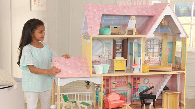 a Girl Playing With Kidkraft Lola Mansion Dollhouse