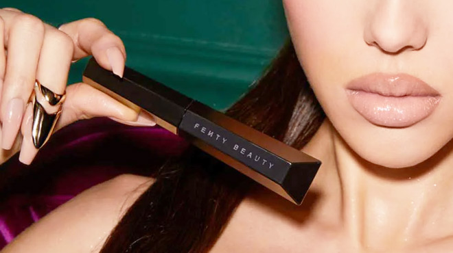 A Lady Holding a Fenty Beauty Thicc Volumizing Mascara Duo