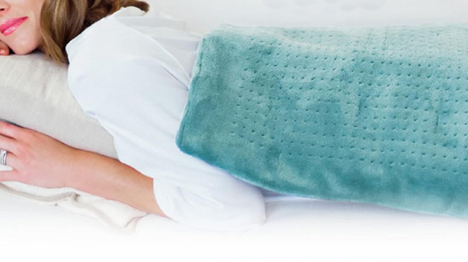 A Lady Sleeping with Pure Enrichment XXL Heating Pad