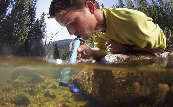 A Man Using LifeStraw Personal Water Filter