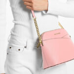 A Person Wearing Pink Michael Kors Crossbody Bag