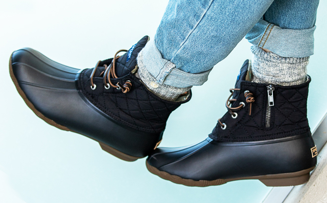 A Person wearing the Sperry Saltwater Quilted Waterproof Winter Duck Boots