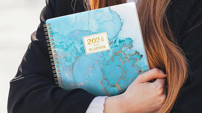 A Woman Carrying 2024 Planner