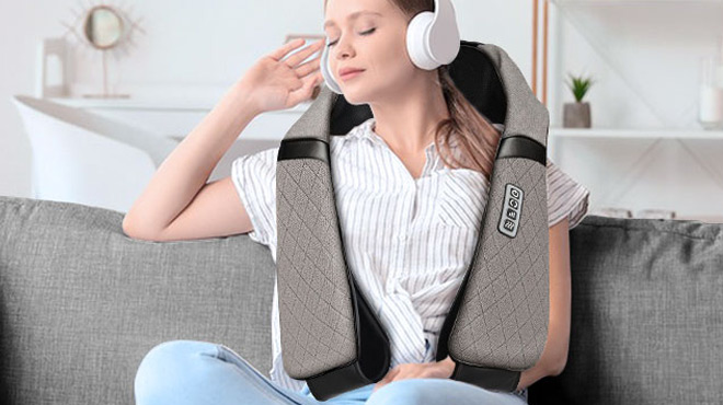 A Women Lounging in Sofa with a Blue Elf Shiatsu Neck Massager on her Shoulders