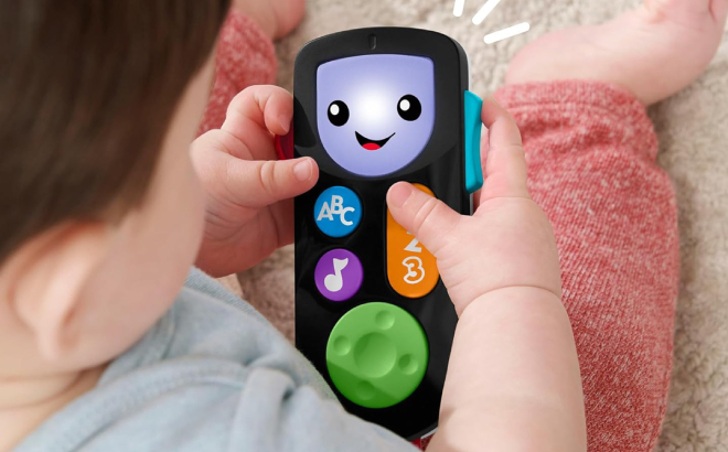 Baby Boy Playing with Fisher Price Remote Toy