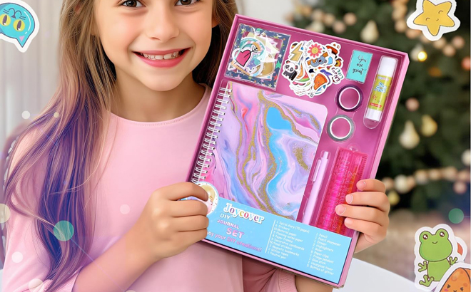 Girl Holding a Joycover Kids Journal in Pink