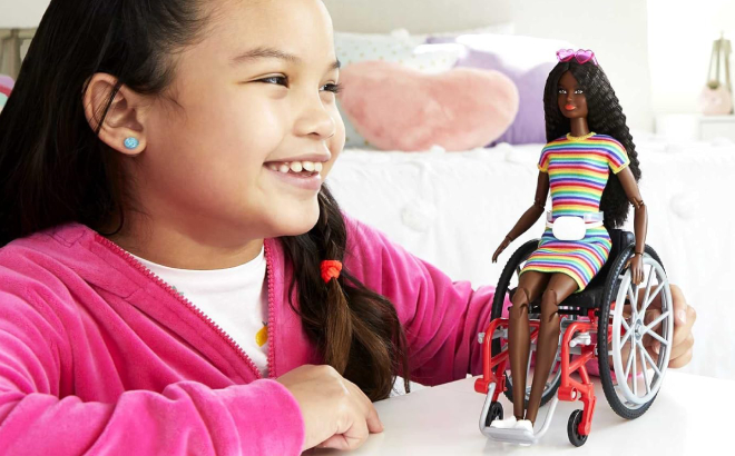 Girl Playing with Barbie Fashionistas Doll with Wheelchair and Ramp