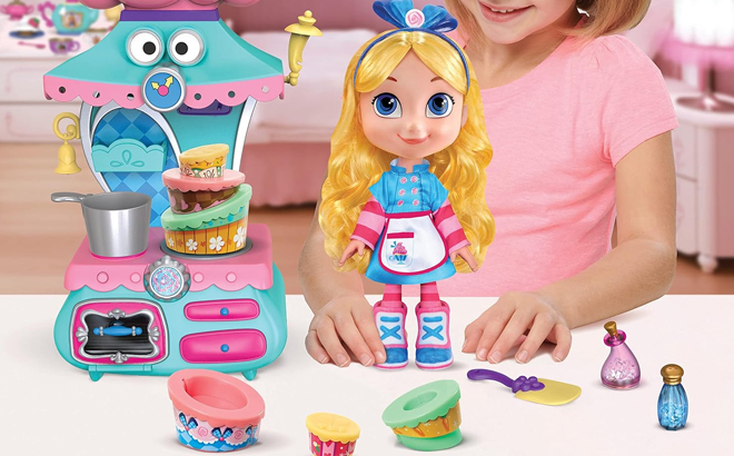 Girl Playing with the Disney Alices Wonderland Bakery Doll and Magical Oven Set