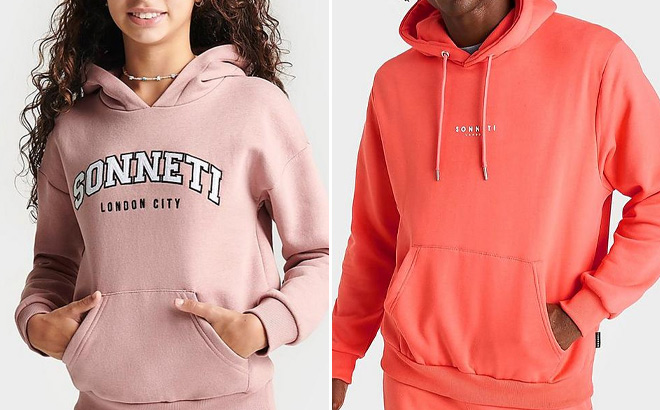 Girl Wearing PInk Hoodie and Man Wearing Orange Hoodie at Finish LIne