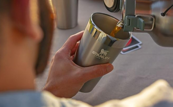 Hand Holding Stanley Stainless Steel Beer Pint