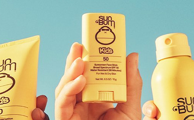 Hand Holding Sun Bum Kids SPF 50 Sunscreen Stick