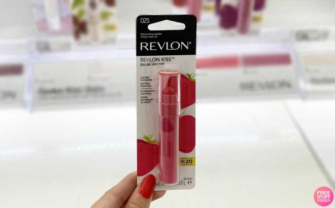 Hand Holding a Revlon Kiss Tinted Lip Balm in Strawberry Shade