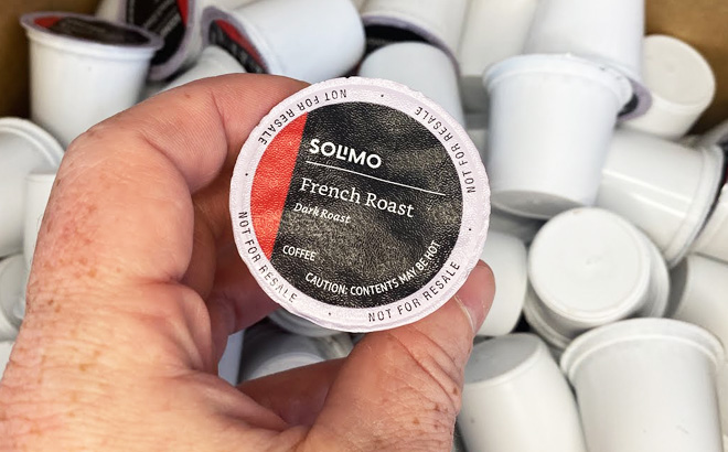 Hand Holding a Solimo French Roast Coffee Pod