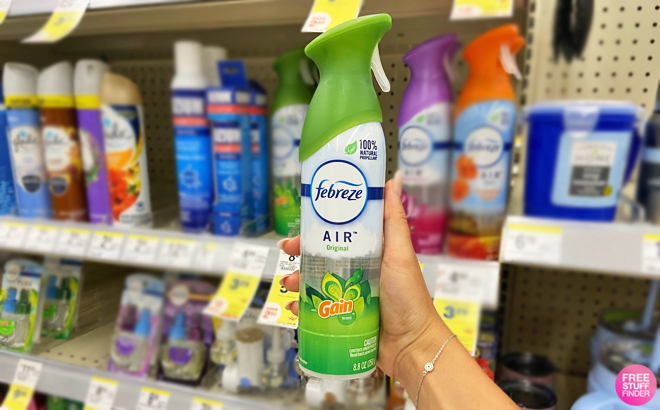 Hand Holding a Spray Bottle of Febreze Air Freshener Gain Original Scent