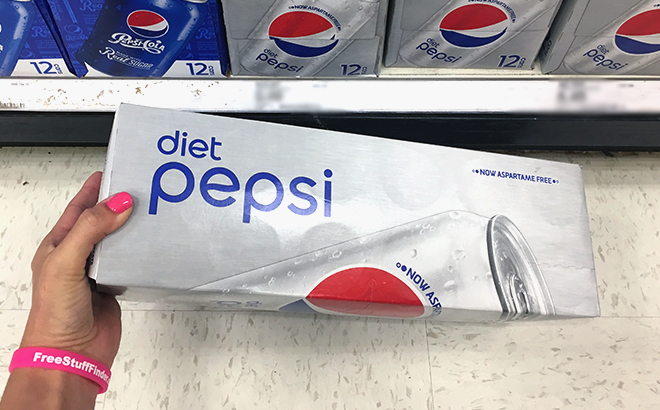 Hand holding Pepsi Diet Soda Can Pack