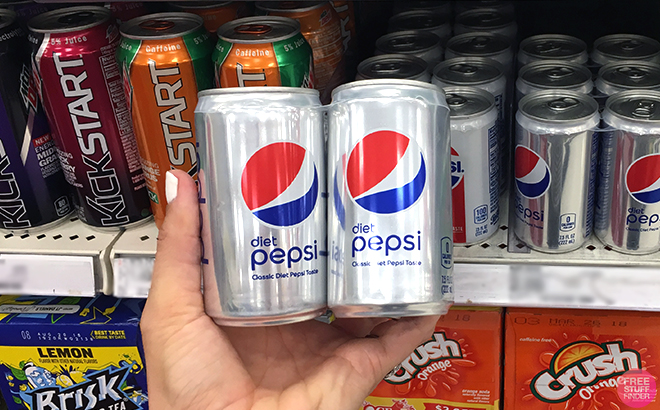 Hand holding Pepsi Diet Soda Mini Can Packs