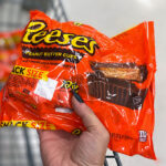 Hand holding Reeses Milk Chocolate Snack Candy