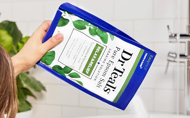 Hands Holding a Dr Teals Relax Relief Pure Epsom Salt Pack