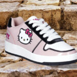 Hello Kitty Womens Pink Casual Court Sneakers on Stairs