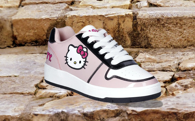 Hello Kitty Womens Pink Casual Court Sneakers on Stairs