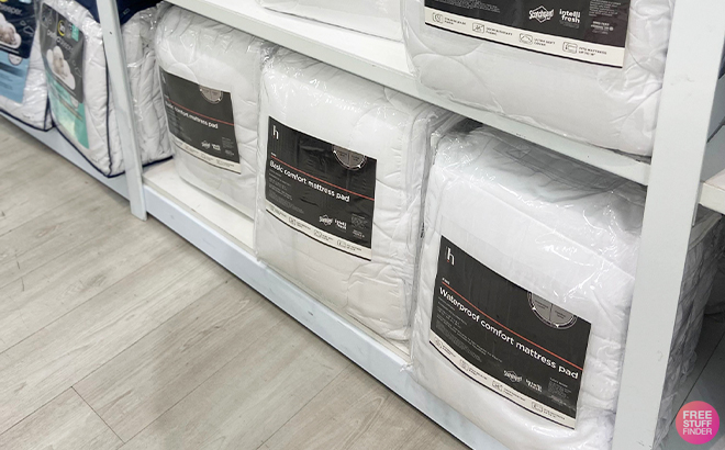 Home Expressions Basic and Waterproof Comfort Classic Plus Mattress Pad on a Shelf at JCPenney