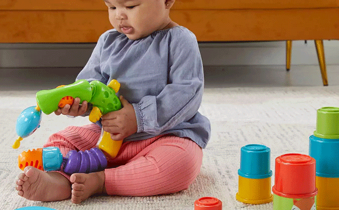 Kid Playing With Fisher Price Ultimate Infant Fundamentals Set 1