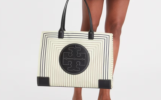 Model Holding Tory Burch Ella Printed Tote Bag