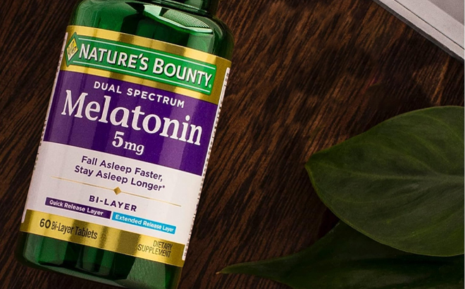 Natures Bounty Melatonin 5mg Dual Spectrum 60 Count Tablets on a Wooden Table