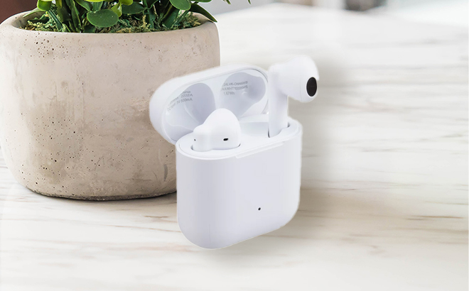 Onn Wireless Earphones with Charging Case in White on a Table