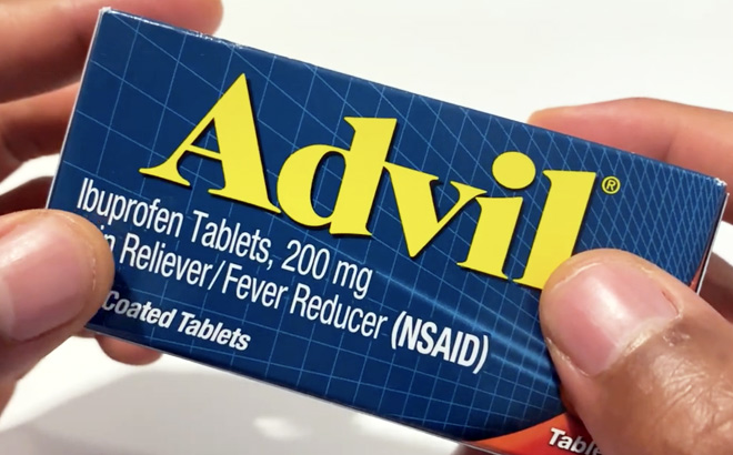 Person Holding Advil Pain Reliever and Fever Reducer 200mg