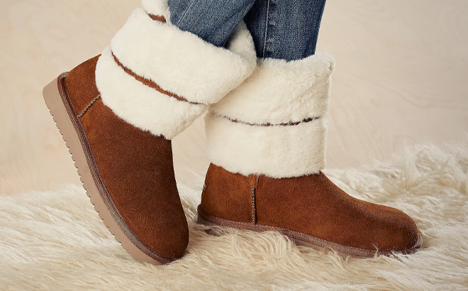 Person Wearing Koolaburra by UGG Suede Faux Fur Short Boot in the Color Chestnut