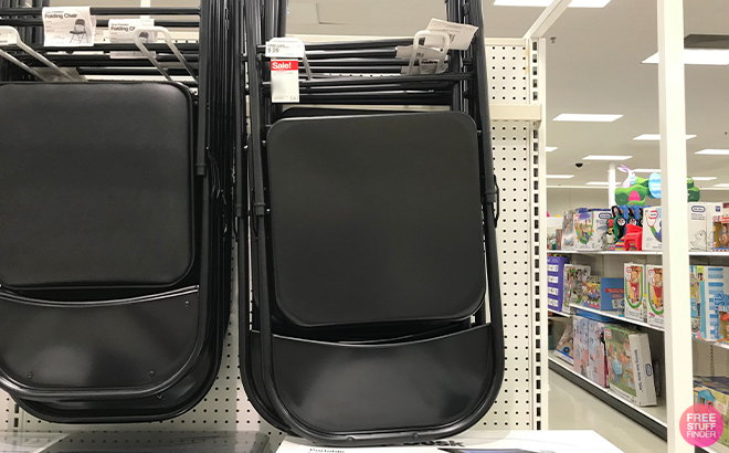 Plastic Development Group Steel Folding Chair in Black on a Shelf at Target