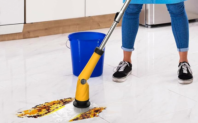 Woman Cleaning Kitchen Floors with the Qimedo Battery Electric Spin Scrubber