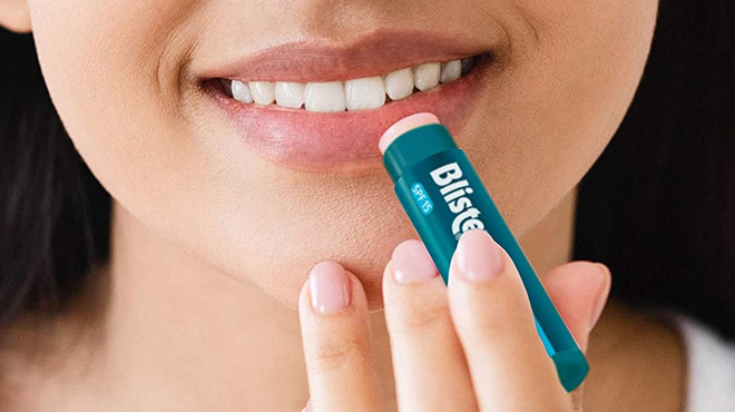 Woman Using Blistex Medicated Lip Balm