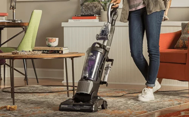 Woman Using the Dirt Devil Power Max Pet Upright Vacuum Cleaner