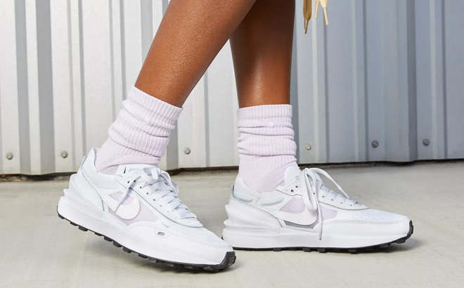 Woman is Wearing Nike Womens Waffle One Shoes in White Color