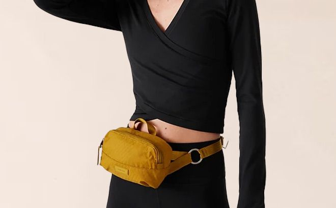 Women Wearing Athleta Crossbody Belt Bag in Yellow 1