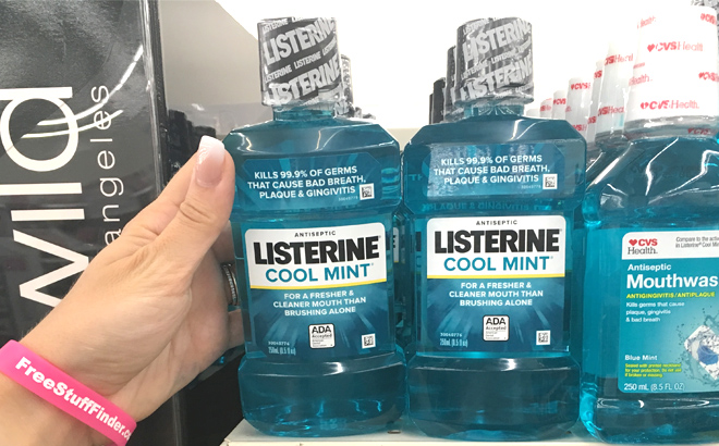 a Hand Holding a Listerine Cool Mint Antiseptic Mouthwash