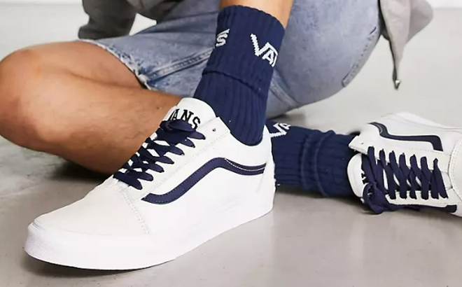 a Person Wearing a Pair of Vans Old Skool Sneakers