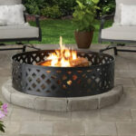 36 Inch Round Metal and Steel Fire Ring Black by Mainstays Placed in a Backyard Garden