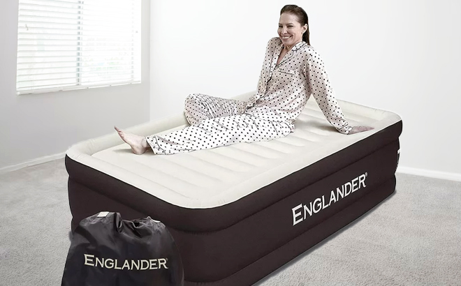 A Person Sitting on Englander Air Mattress in Brown Color