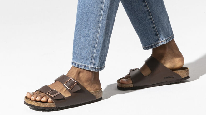 A Person Wearing Birkenstock Birko Floor Dark Brown Sandals