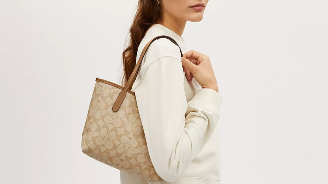 A Person Wearing Coach Mini City Tote Bag