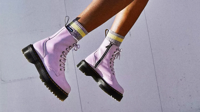 A Person Wearing a Pair of Dr Martens Boot Platforms in Lilac