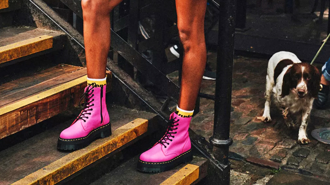 A Person Wearing a Pair of Dr Martens Boot Platforms in Pink